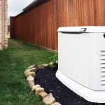 Standby generator installed in a landscaped yard, providing reliable power during outages, emphasizing safety and comfort for families.