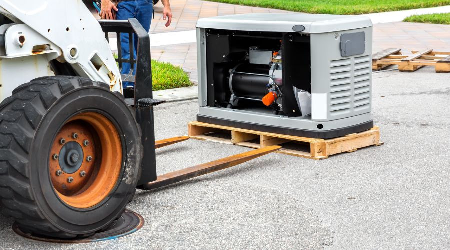 Forklift transporting a standby generator on a pallet, showcasing essential home power solutions for safety and convenience during outages.